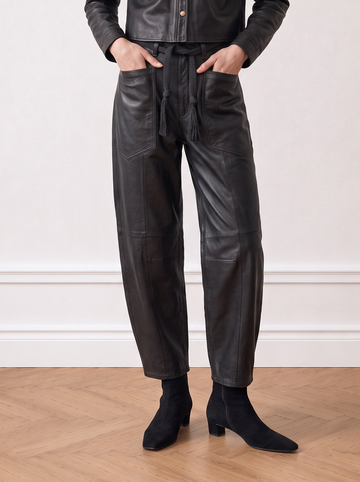 Belted barrel-leg leather trousers